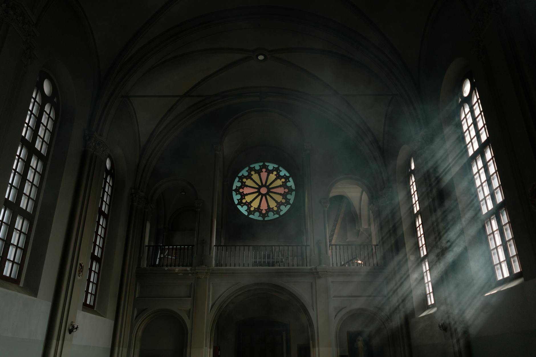dark cathedral interior and light from the windows