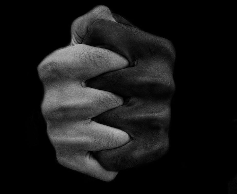 clasped hands of multiethnic people